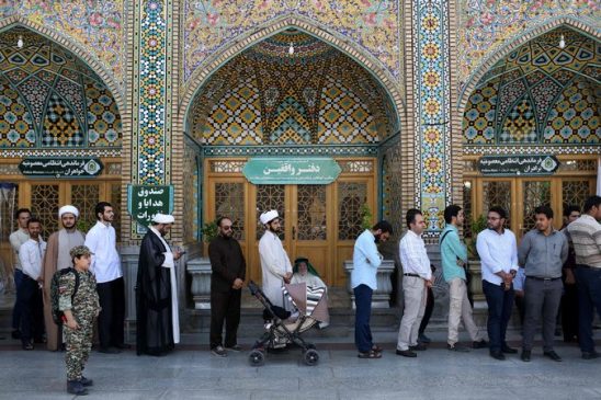 Iranians lined up on Friday in Qum to cast their ballots in municipal and presidential elections. Voting hours had to be extended. Credit Ali Shaigan/Agence France-Presse — Getty Images