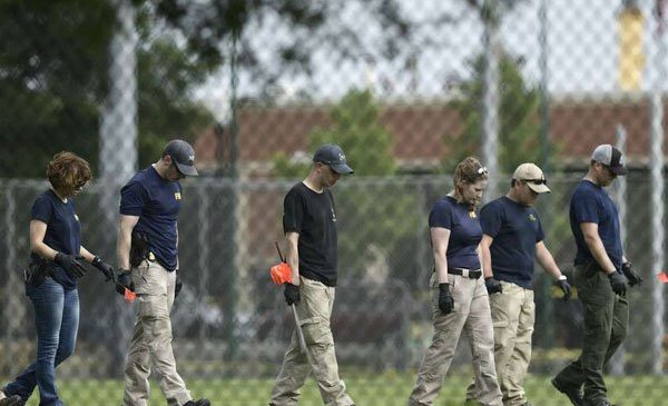 FBI and other law enforcement officials inspect the crime scene after the shooting on June 14, 2017. PHOTO | BRENDAN SMIALOWSKI | AFP