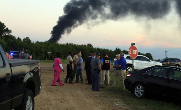Rescue agents at the scene of the plane crash in Mississipp